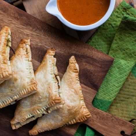 Veggie hand pies with red pepper sauce